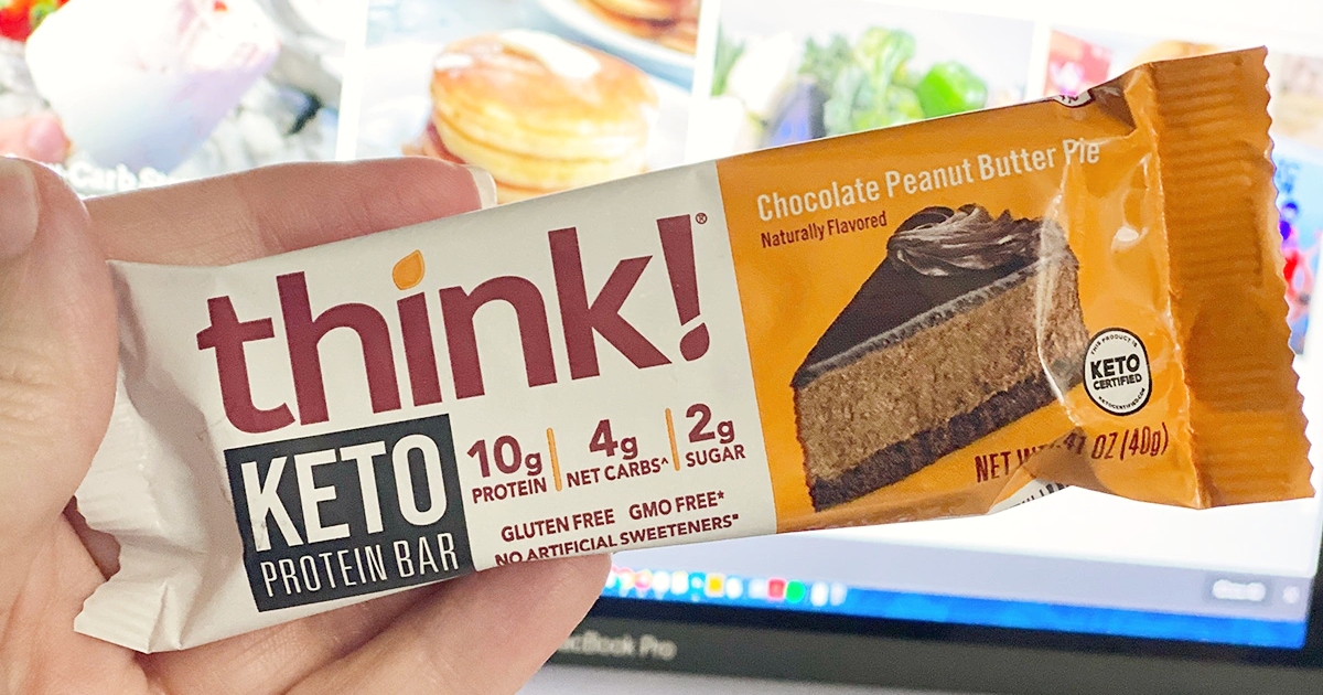 holding a protein bar
