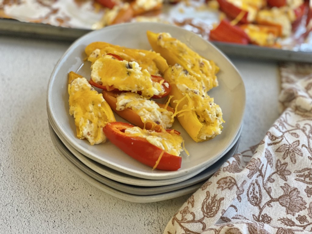 cream cheese stuffed mini peppers on a plate 