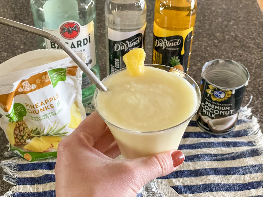 holding a keto piña colada