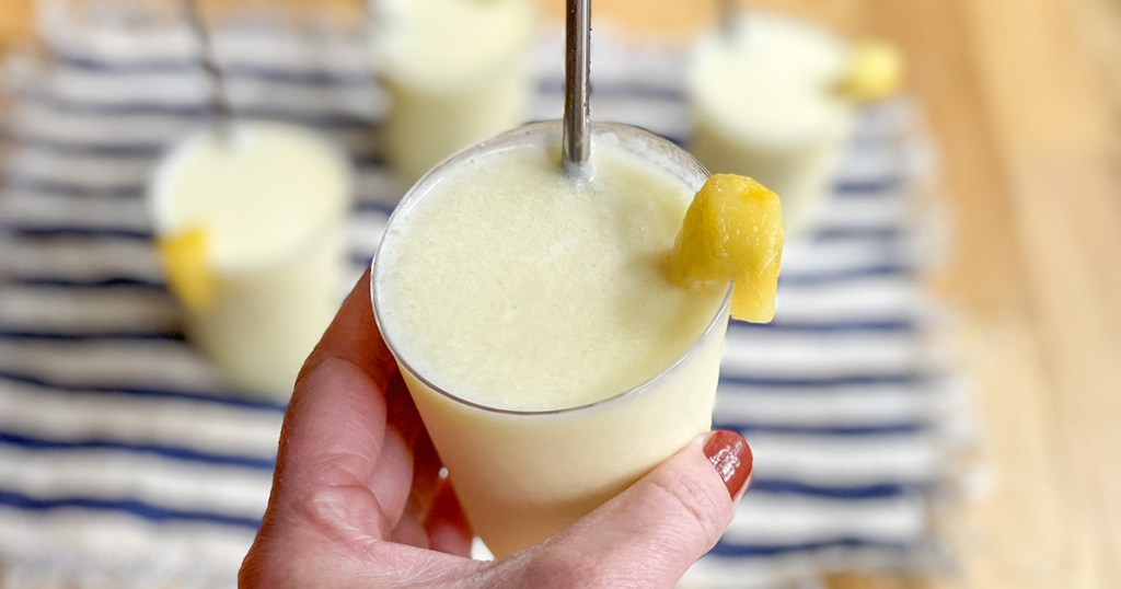 holding a keto piña colada