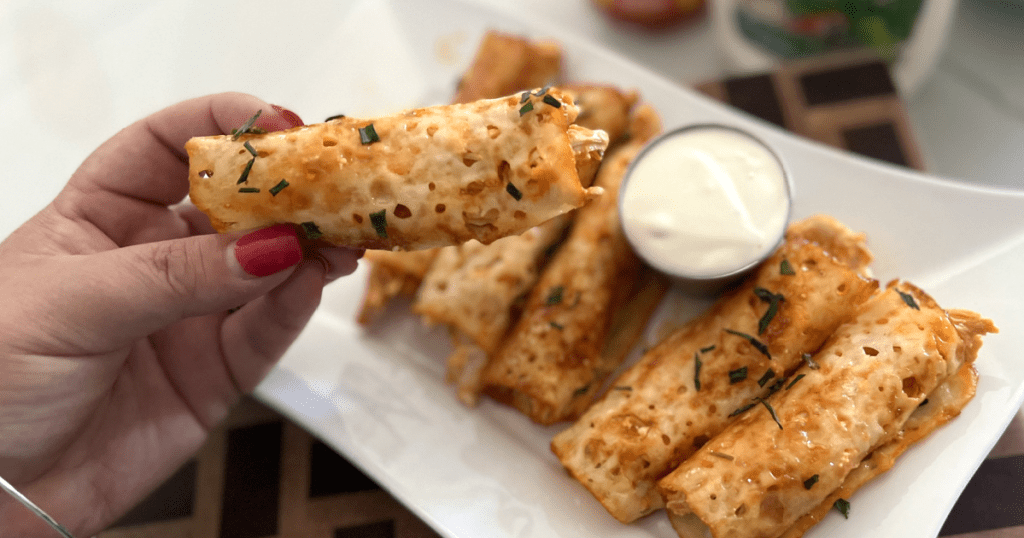 holding buffalo chicken rollup