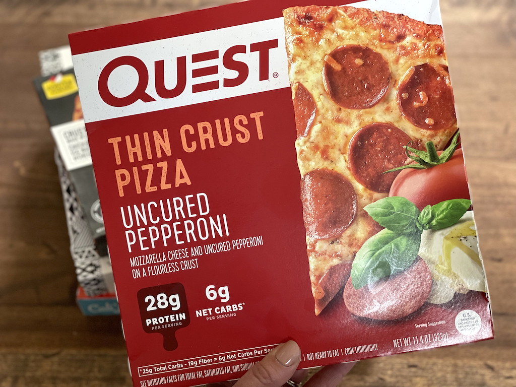 holding Quest keto frozen pepperoni pizza 