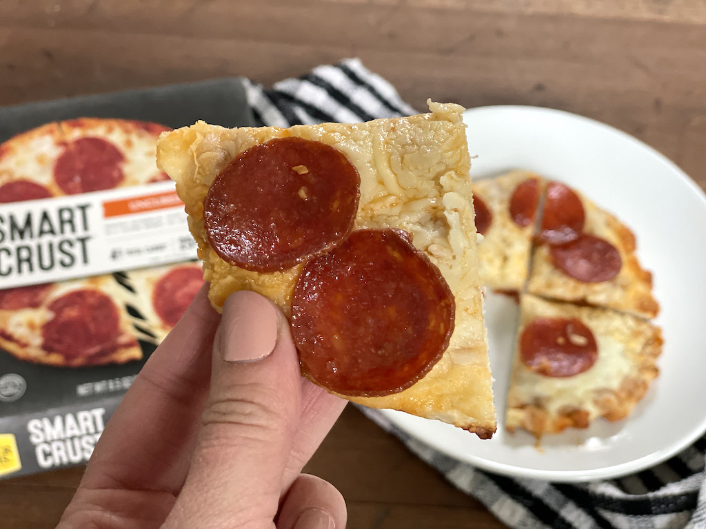 holding smart crust pepperoni pizza 