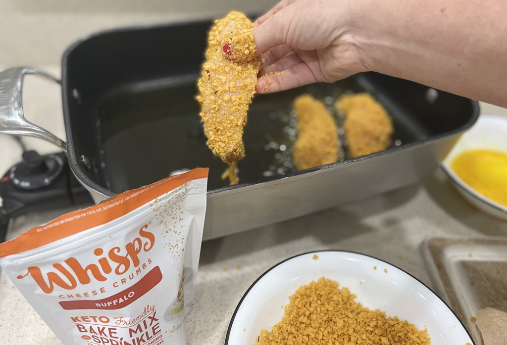 whisps keto bread crumbs frying on chicken in oil
