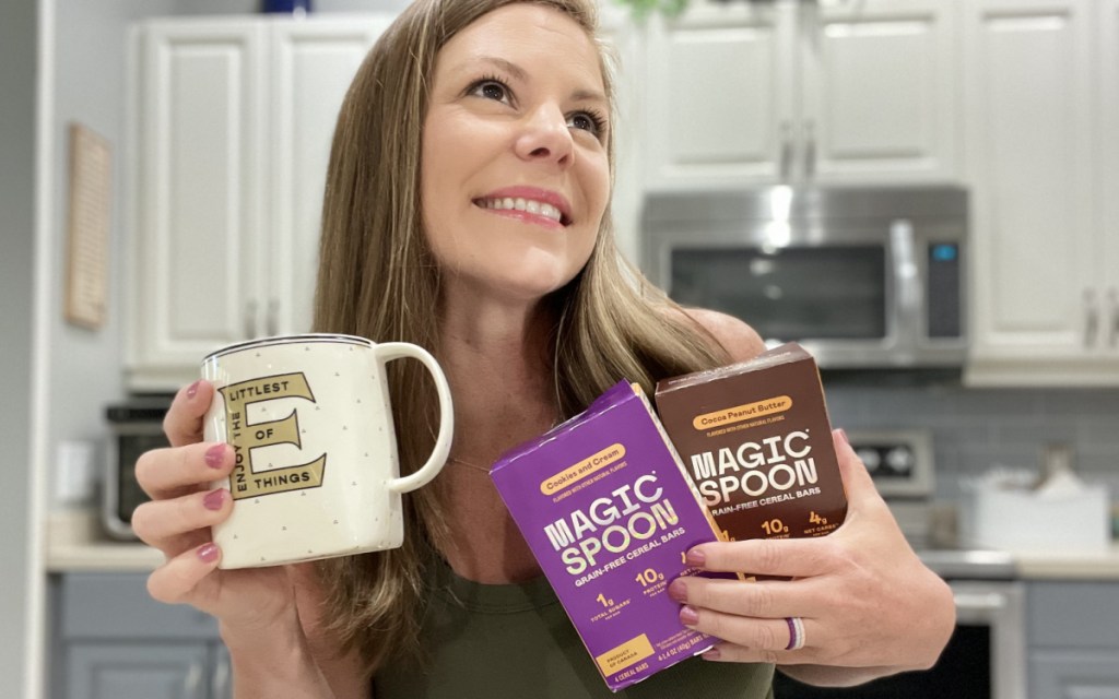 woman holding magic spoon cereal bars