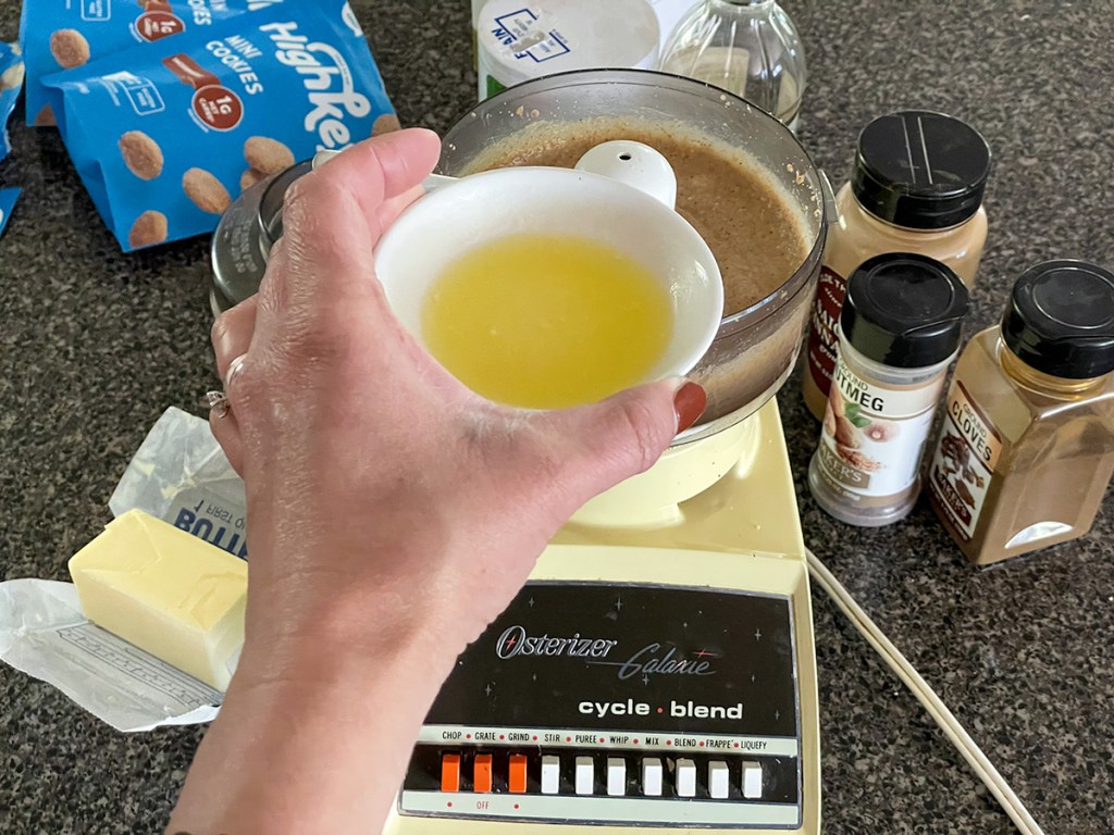 adding butter to food processor 