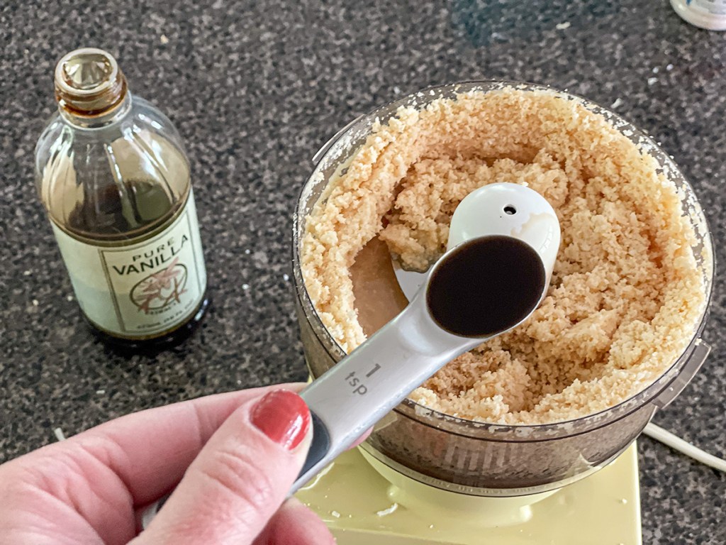 adding vanilla to puréed coconut