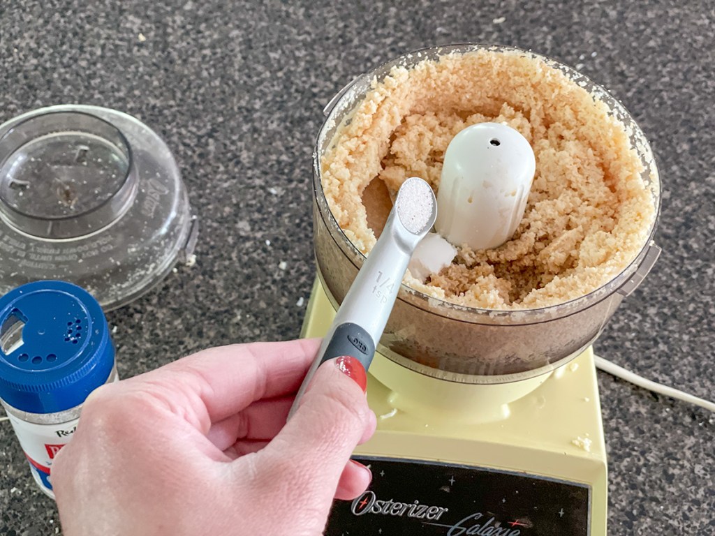adding salt to coconut puree 