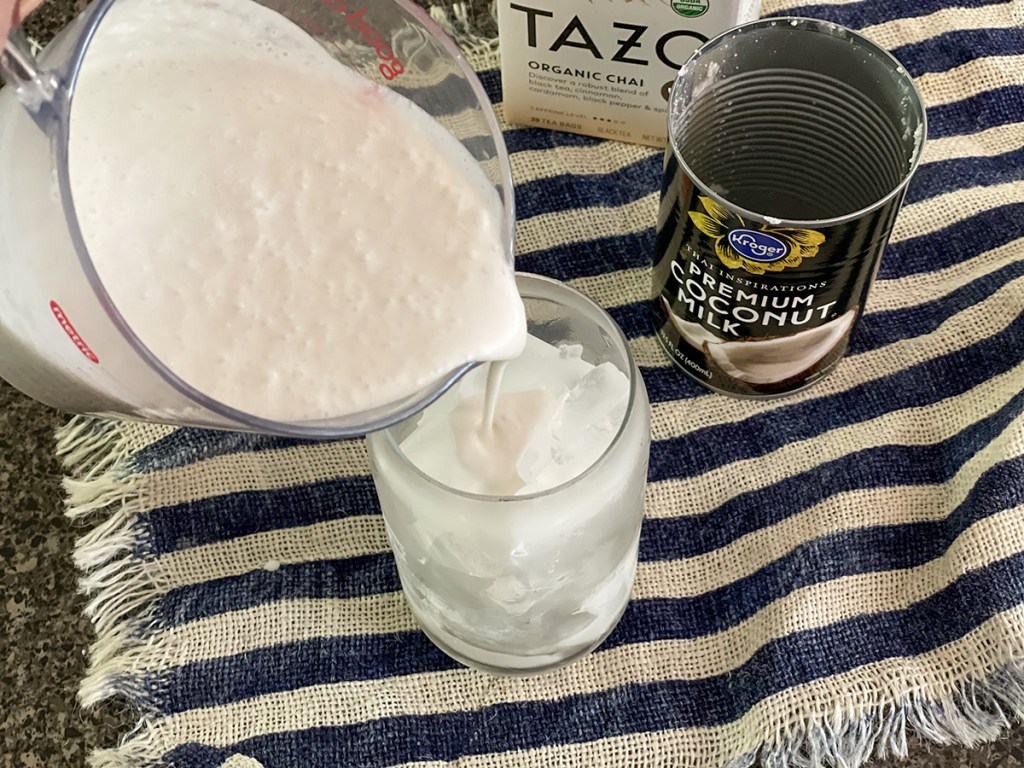 pouring coconut milk into a glass