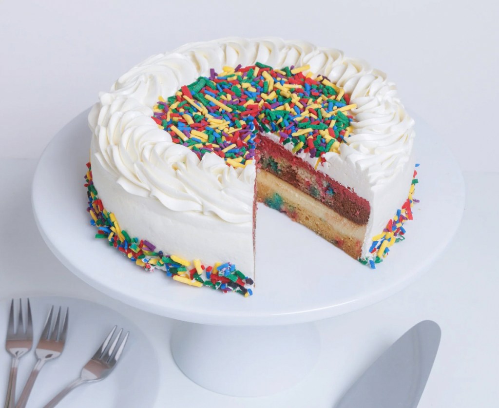 birthday neopolitan cake on stand