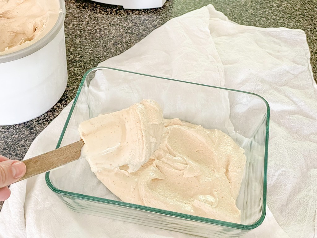 putting ice cream in a container 