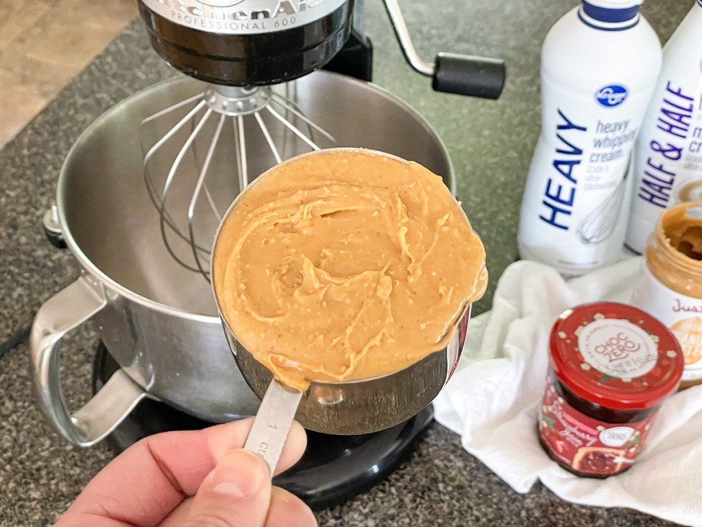 measuring cup of peanut butter