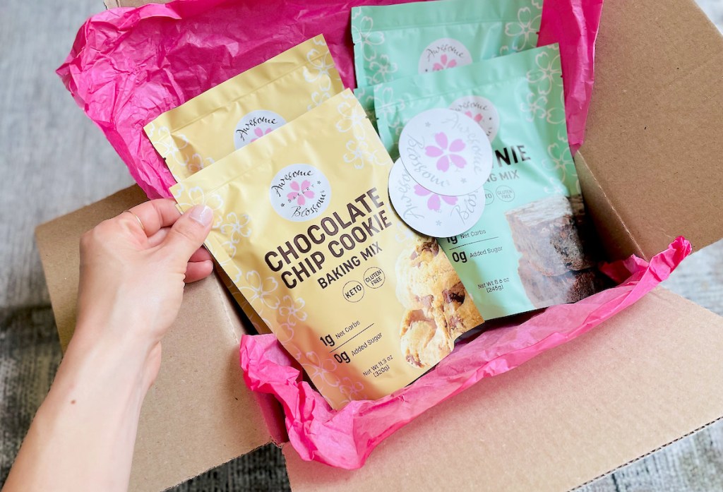 hand holding awesome blossom baking mixes from shipping box