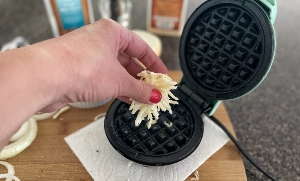 adding cheese to mini waffle maker