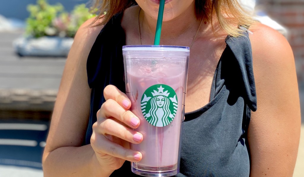 woman sipping on a keto pink drink copycat