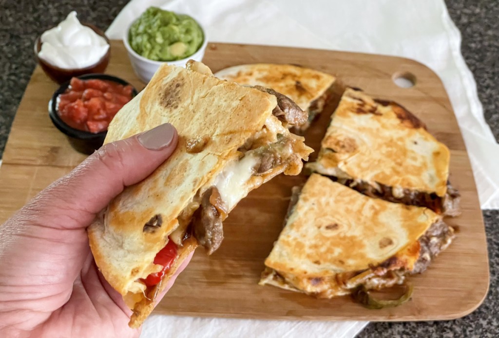 holding steak quesadilla