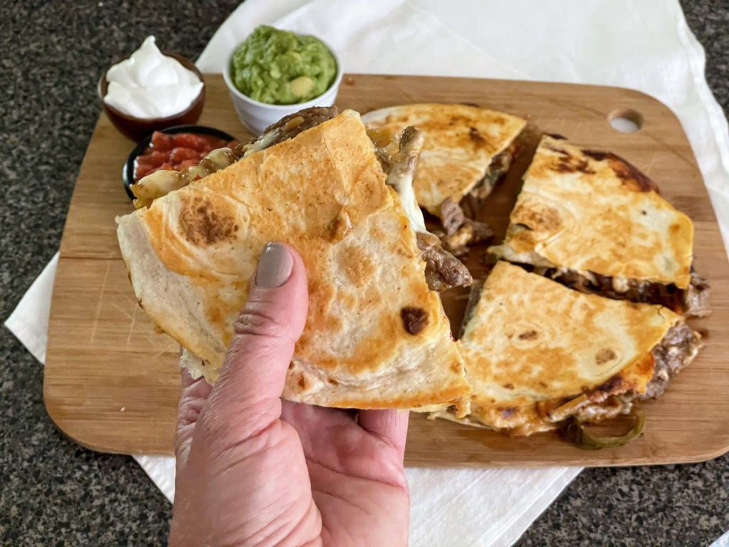 holding steak quesadilla