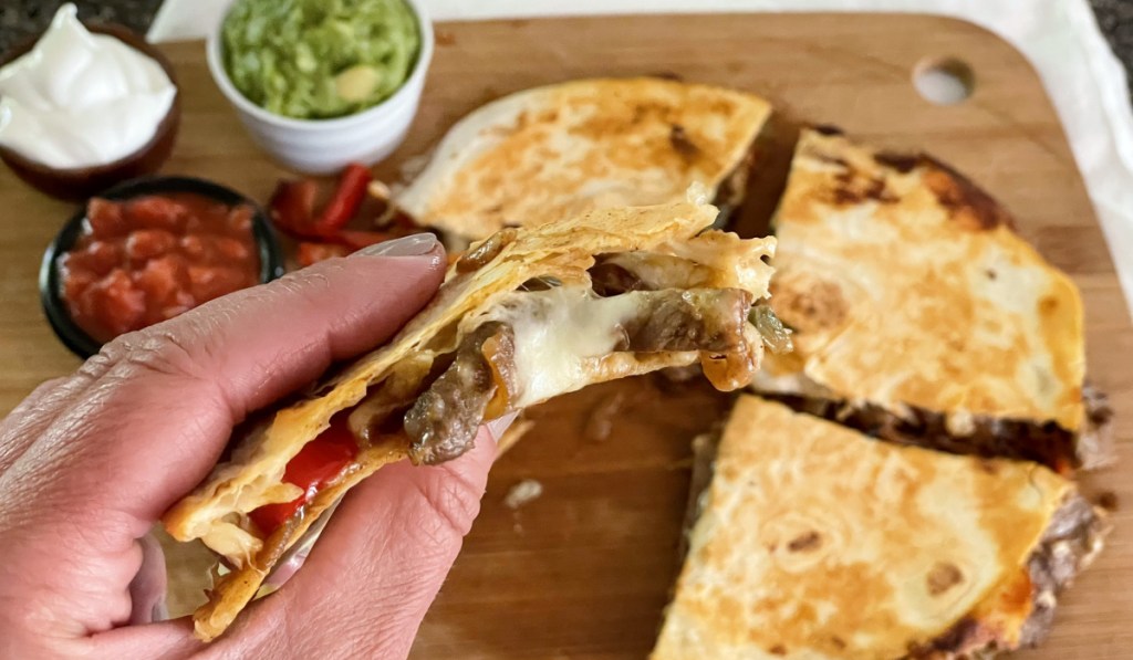 holding steak quesadilla 