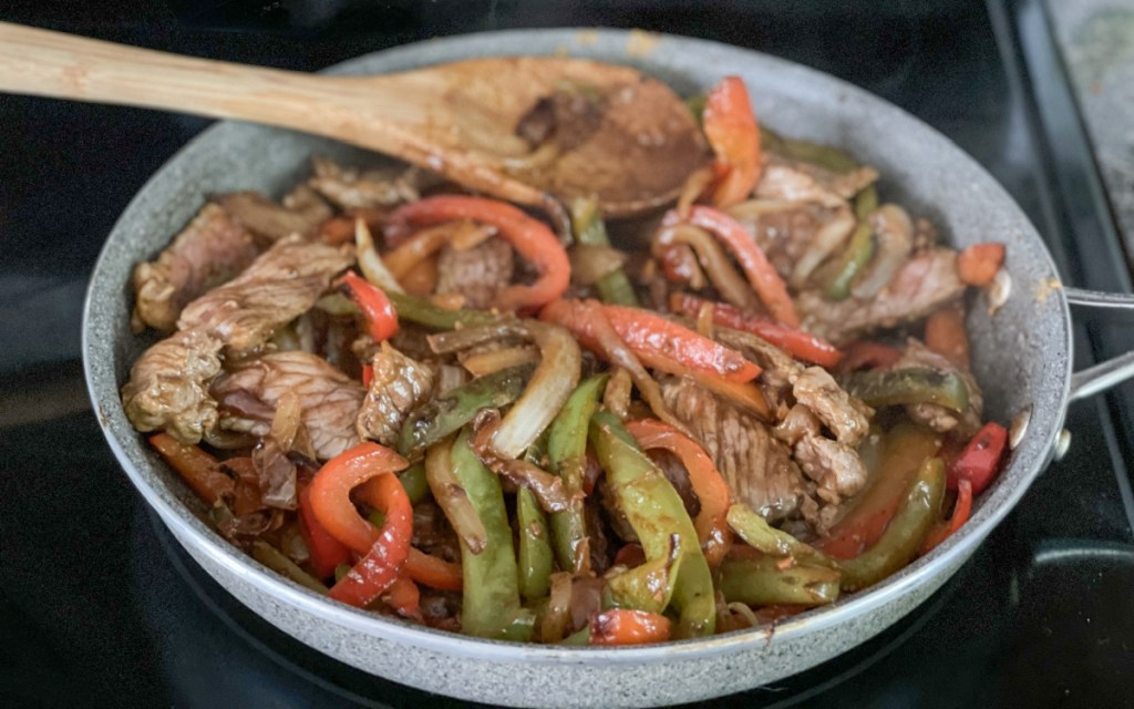 steak fajitas in a skillet