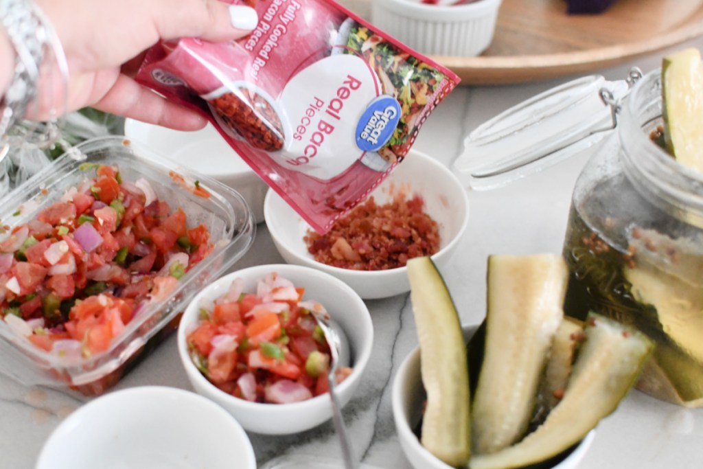 adding toppings to bowls