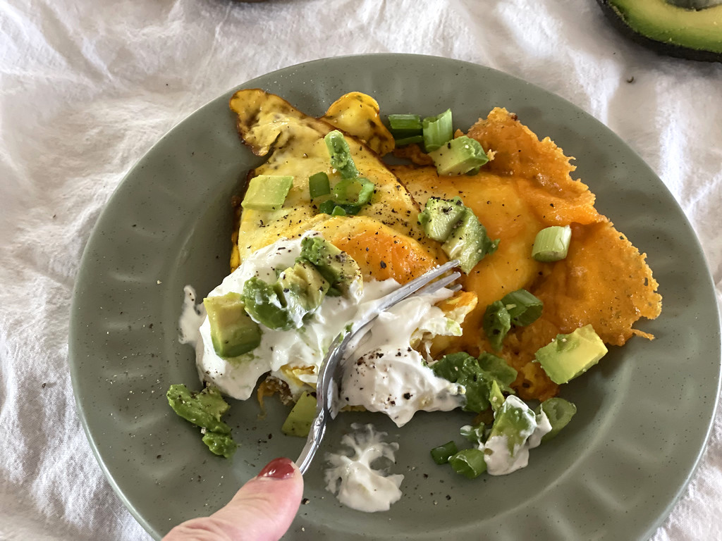 eggs with cheese, avocado, and sour cream