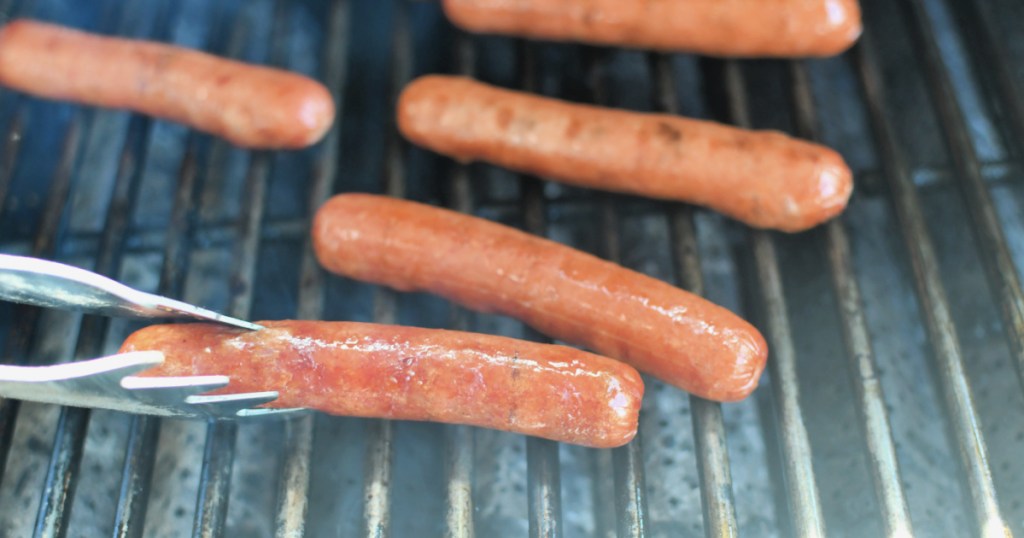 grilling hot dogs on a gas grill