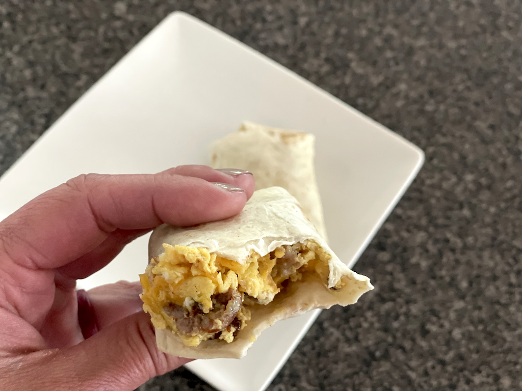 holding Hero tortilla breakfast burrito 