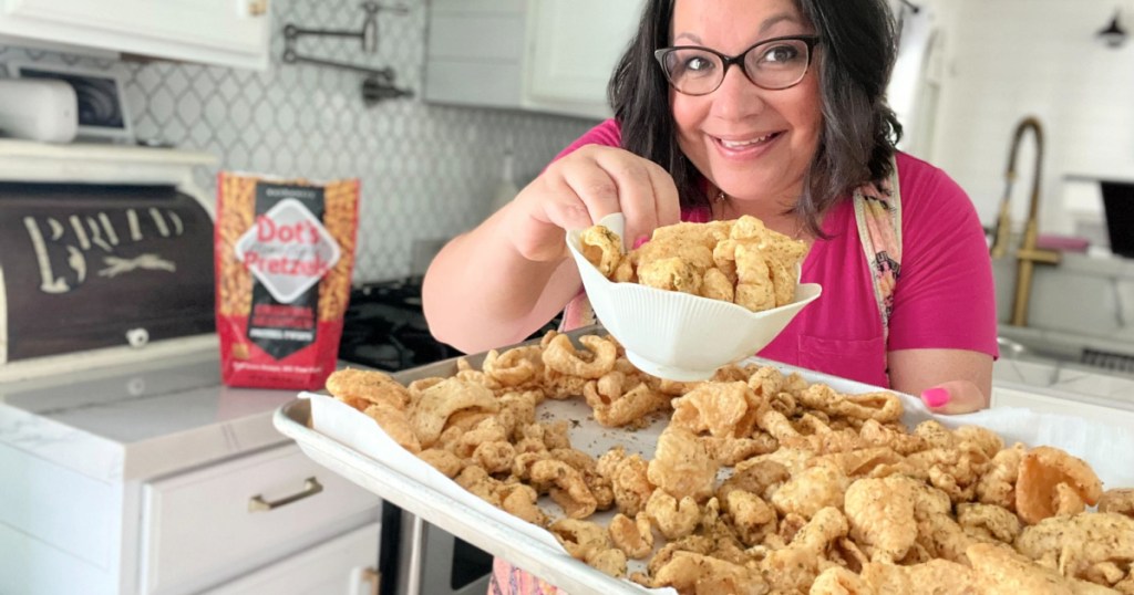 holding a sheet pan of copycat dot's pork rinds