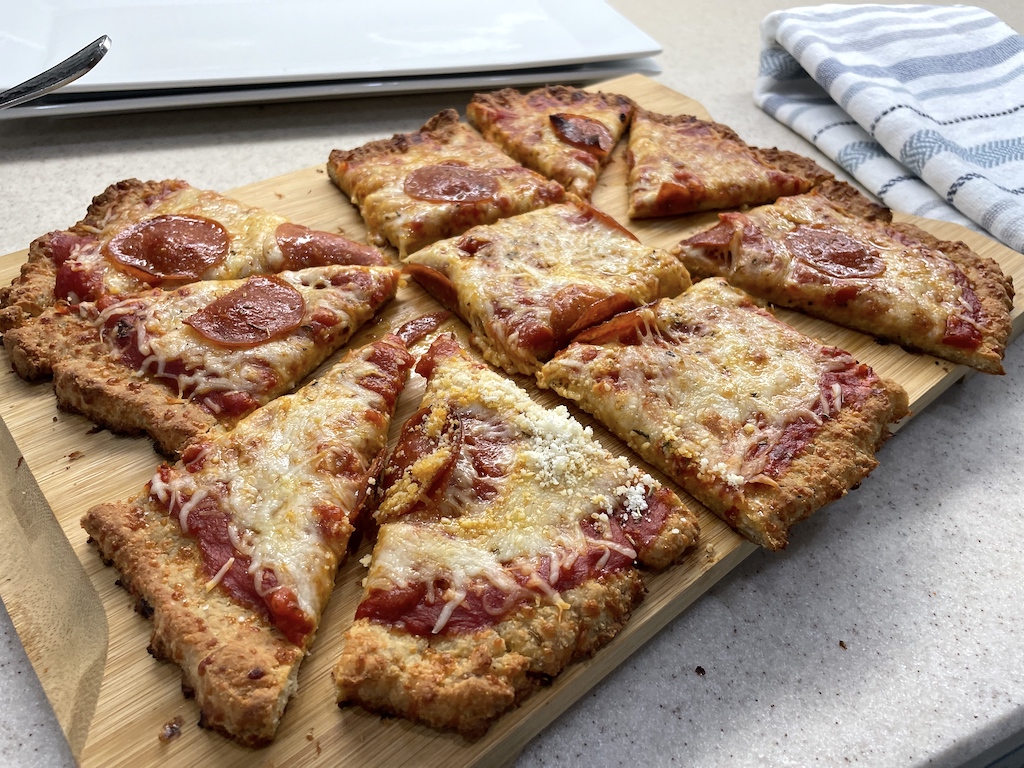 pepperoni sausage crust pizza sliced up 