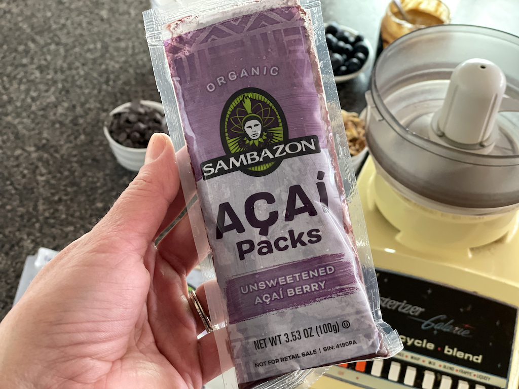 holding Sambazon Acai packs