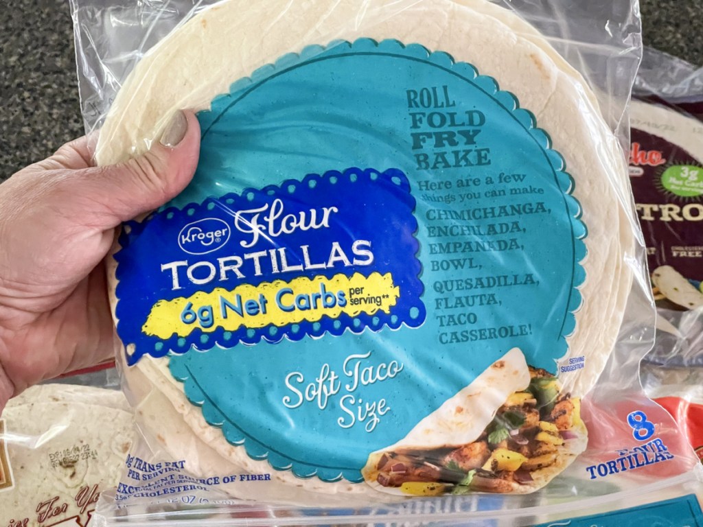 holding a package of keto tortillas