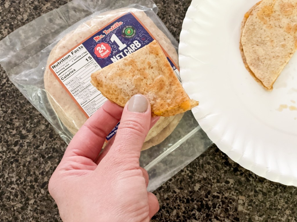 holding a cheese quesadilla