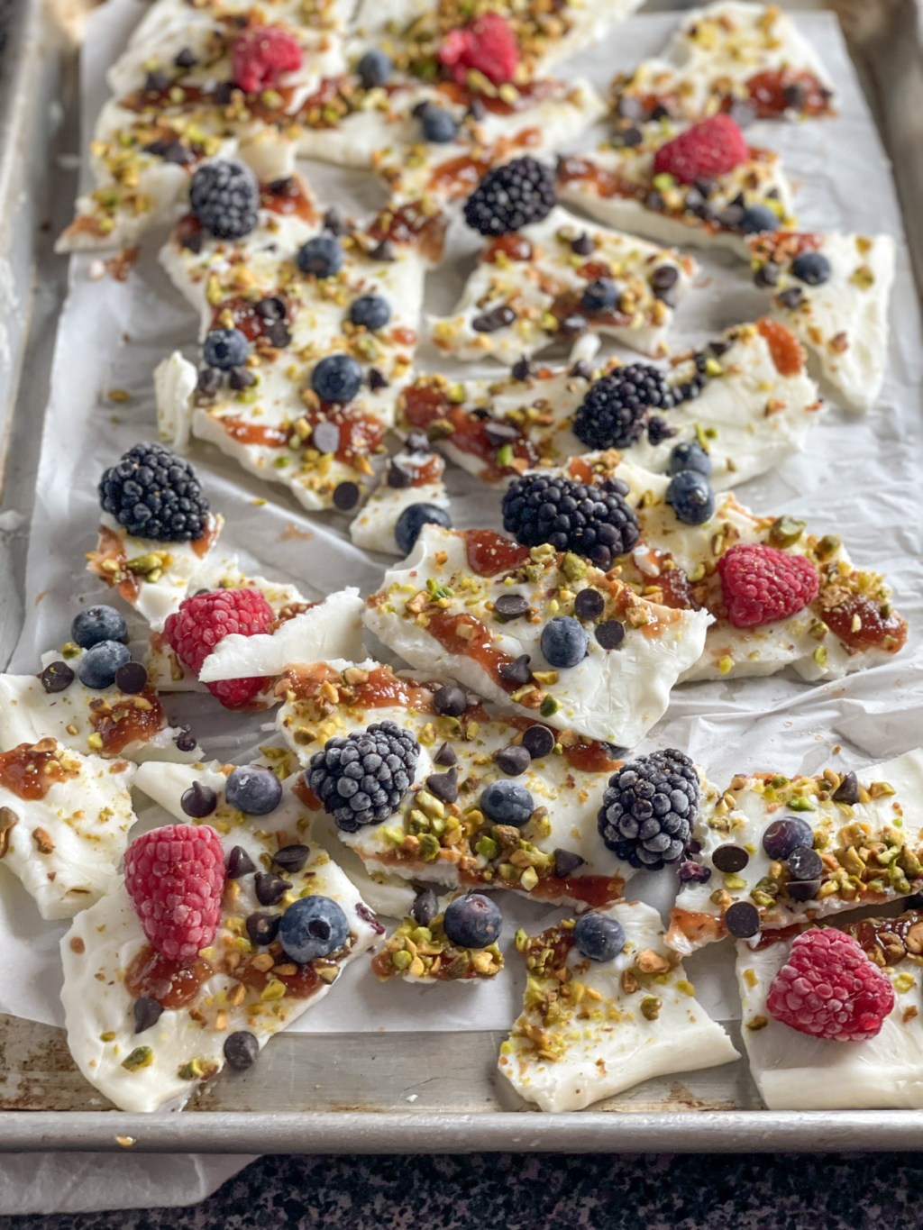 Keto Frozen Greek Yogurt Bark broken into pieces