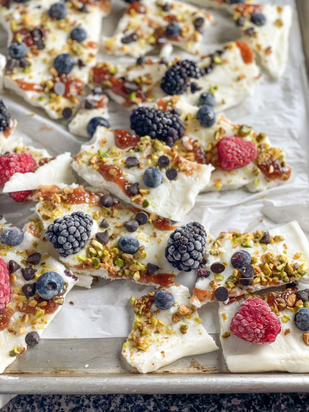 Keto Frozen Greek Yogurt Bark broken into pieces