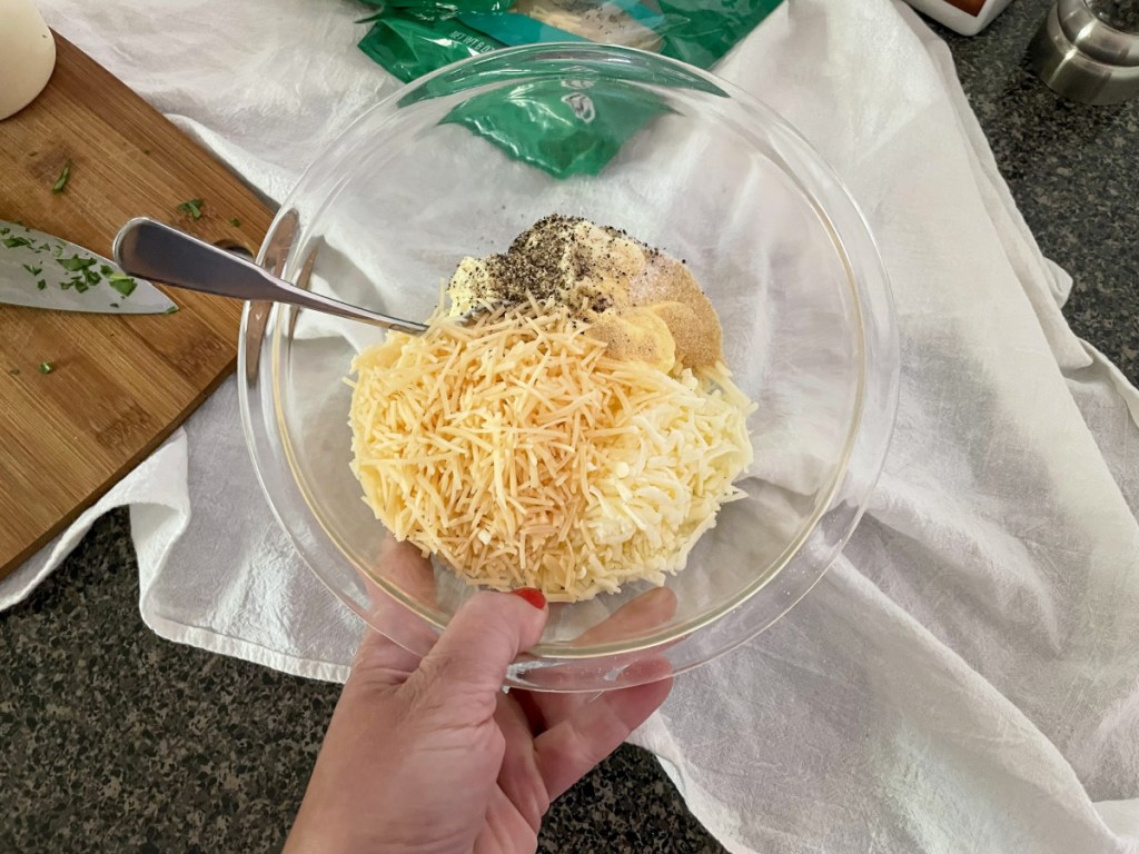 bowl of mayo, shredded cheese, seasonings