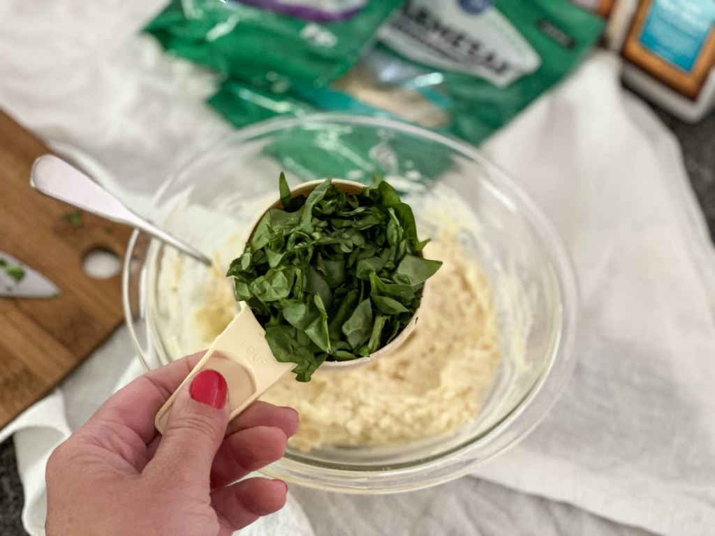 measuring cup of chopped spinach