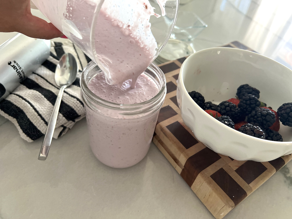 pouring kefir in mason jar 