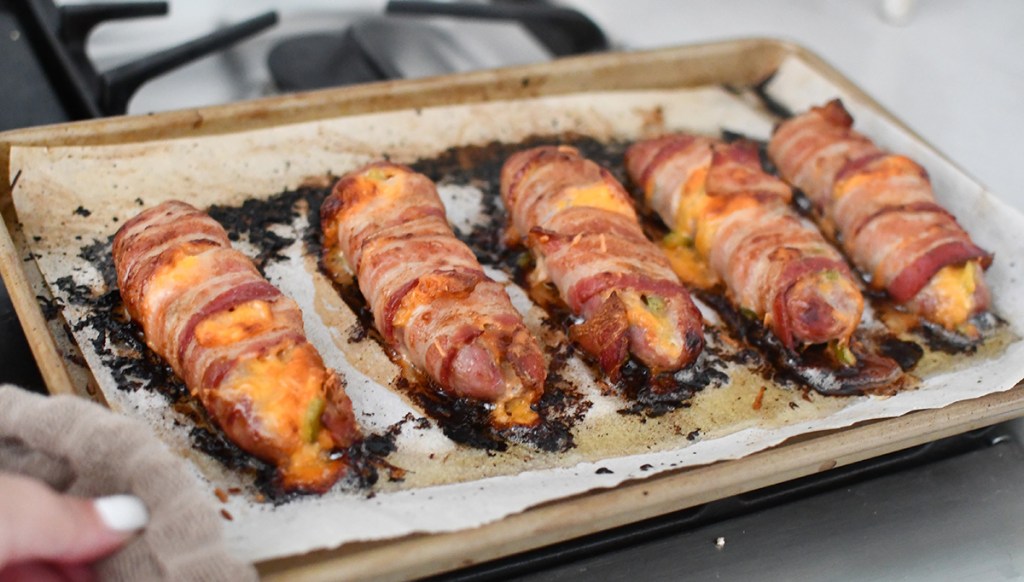 tray of keto bacon wrapped sausages