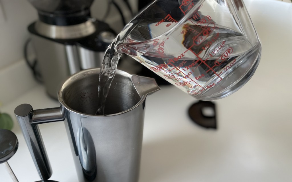 pouring water into French press