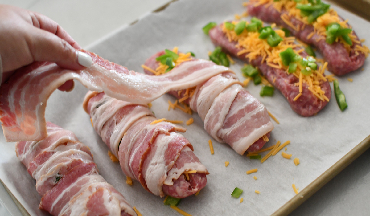 Bacon Wrapped Sausage Stuffed with Cheese and Jalapeños