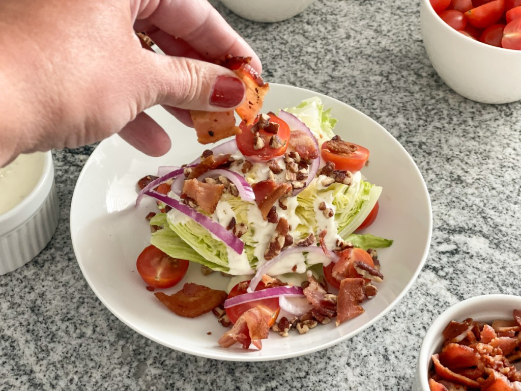 adding bacon to a wedge salad