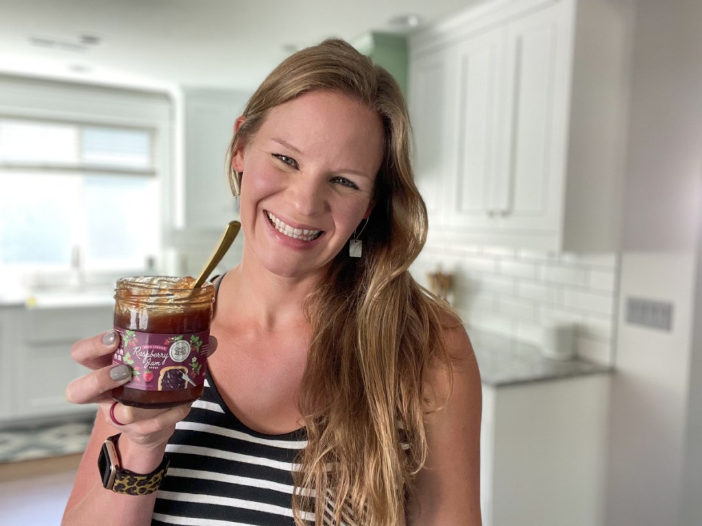 woman holding jar of choczero raspberry jam