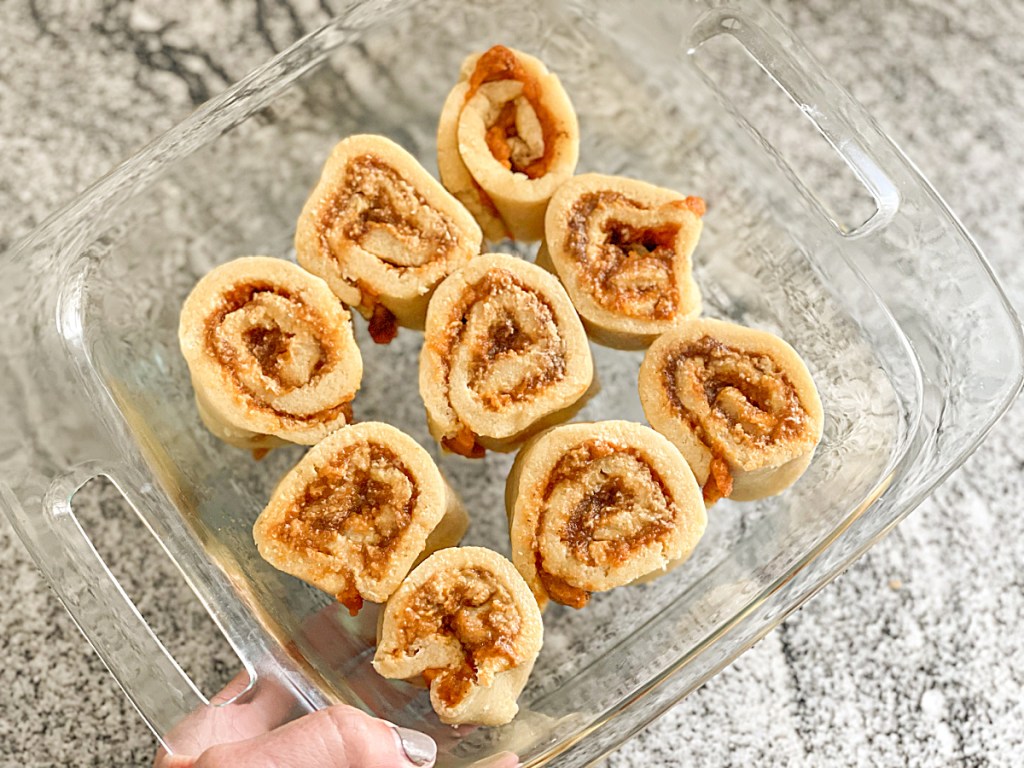 raw keto pumpkin cinnamon rolls in a baking dish