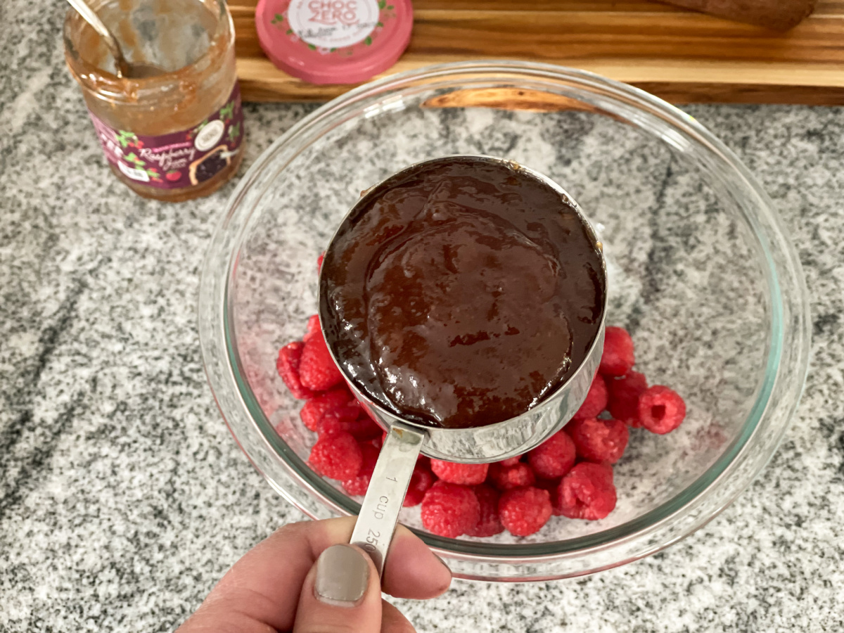measuring cup of choczero raspberry jam