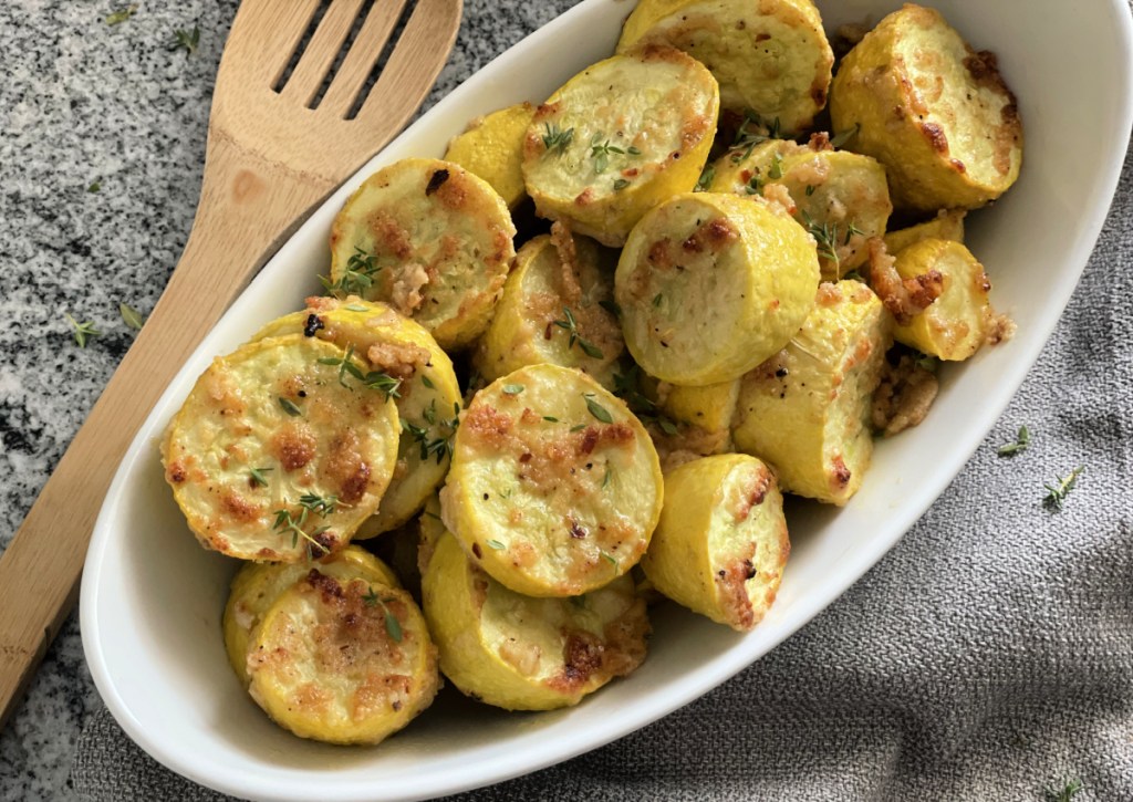 A platter of roasted yellow squash with garlic and Parmesan