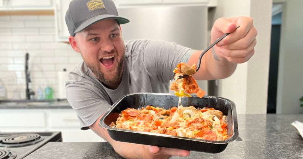 man with papa johns bowl