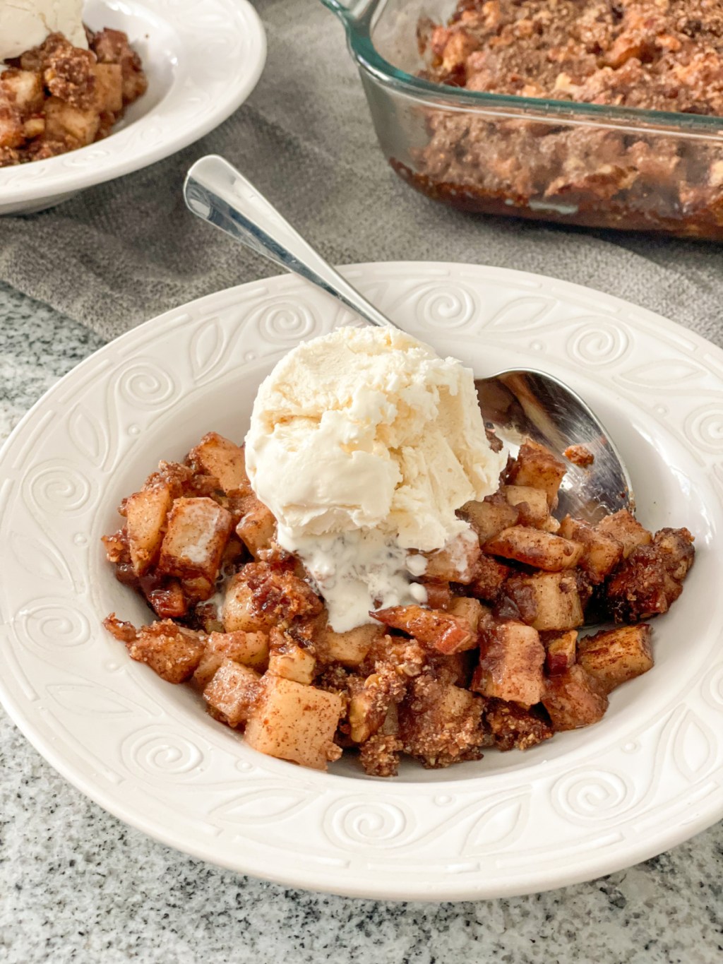 bowl of keto apple crisp with keto ice cream