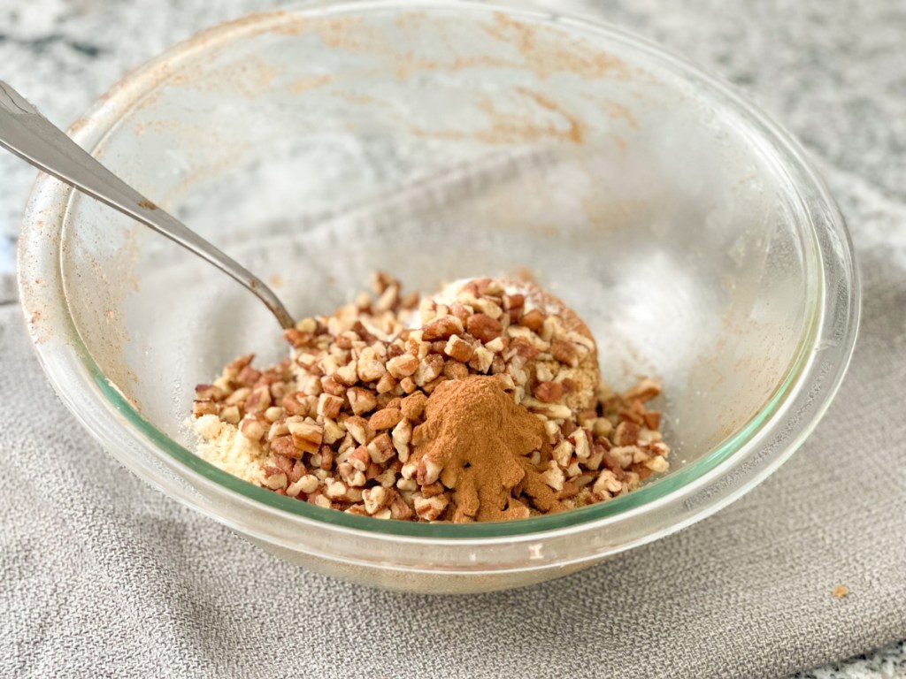 chopped pecans, cinnamon, almond flour in a glass bowl