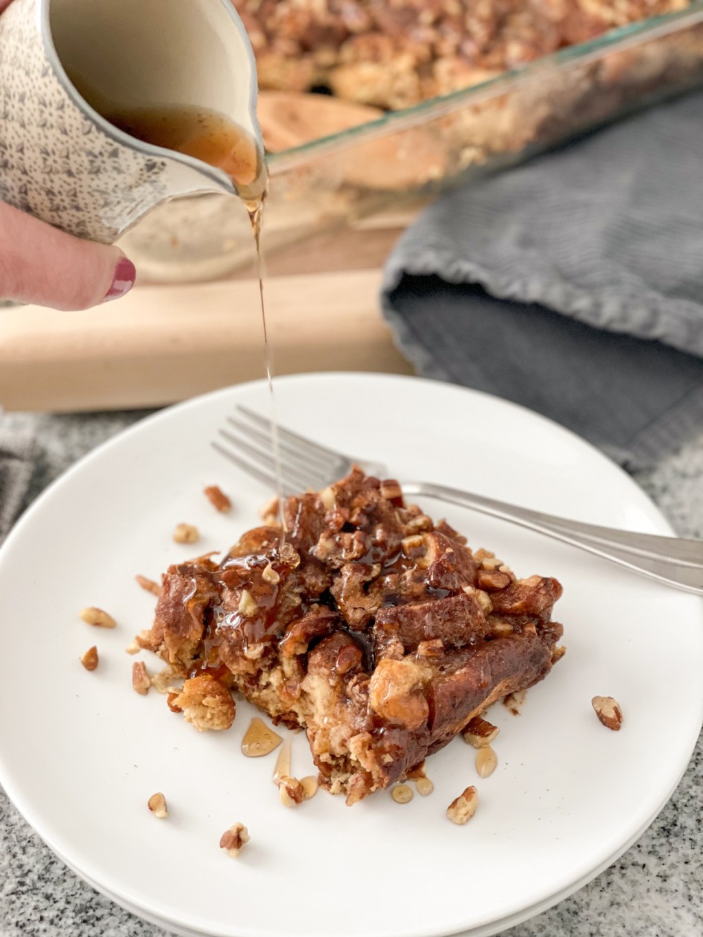 pouring syrup over Keto French Toast Casserole made with Hero seeded bread