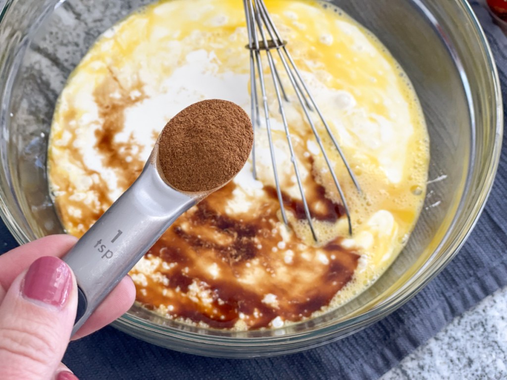 adding cinnamon to a bowl